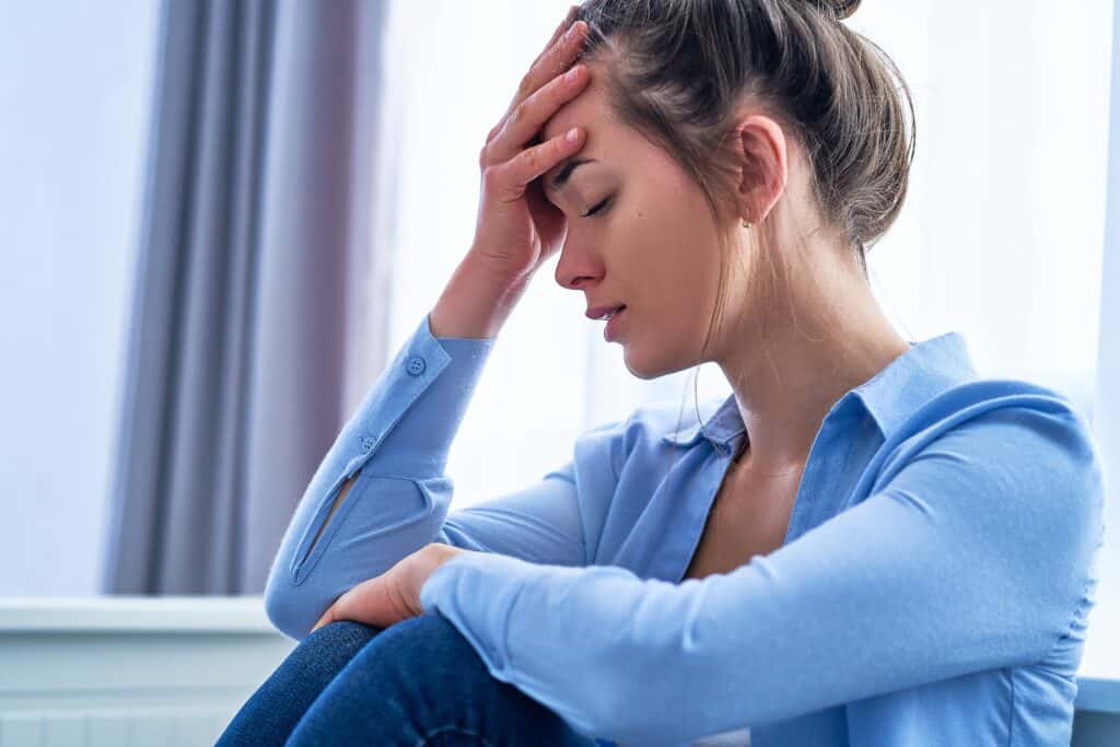 woman suffers a headache during carfentanil withdrawal