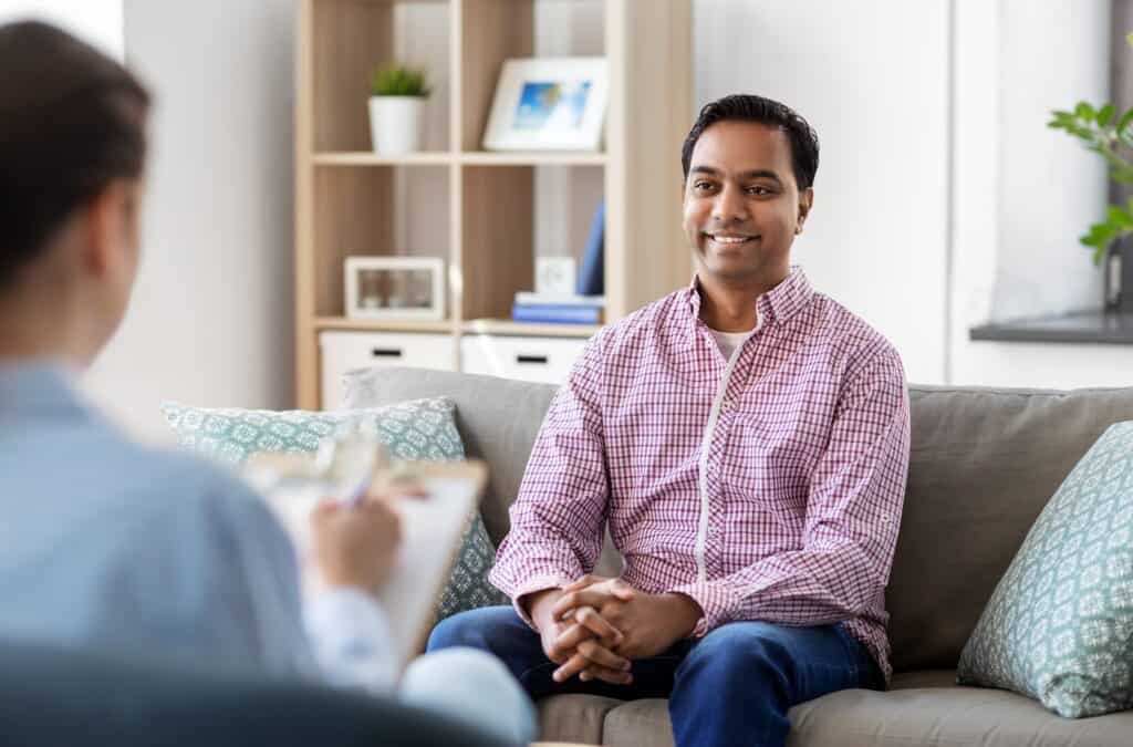 man in an individual therapy session covered by Cigna for rehab