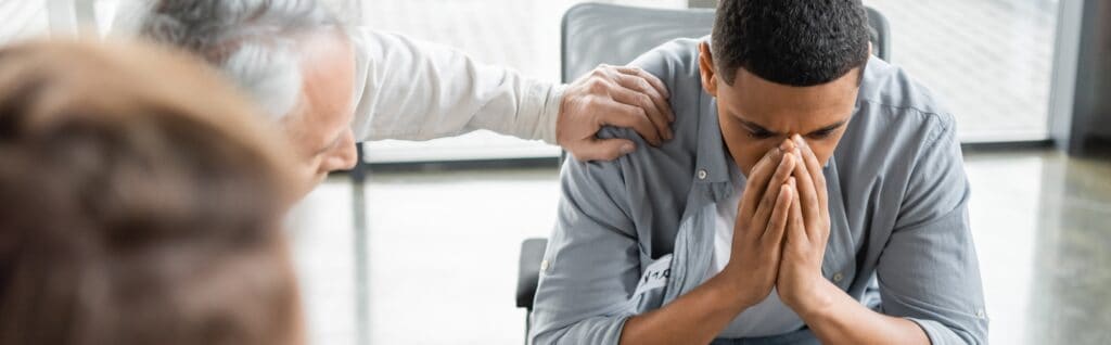 A man during heroin detox in Florida, participating in a group therapy session.