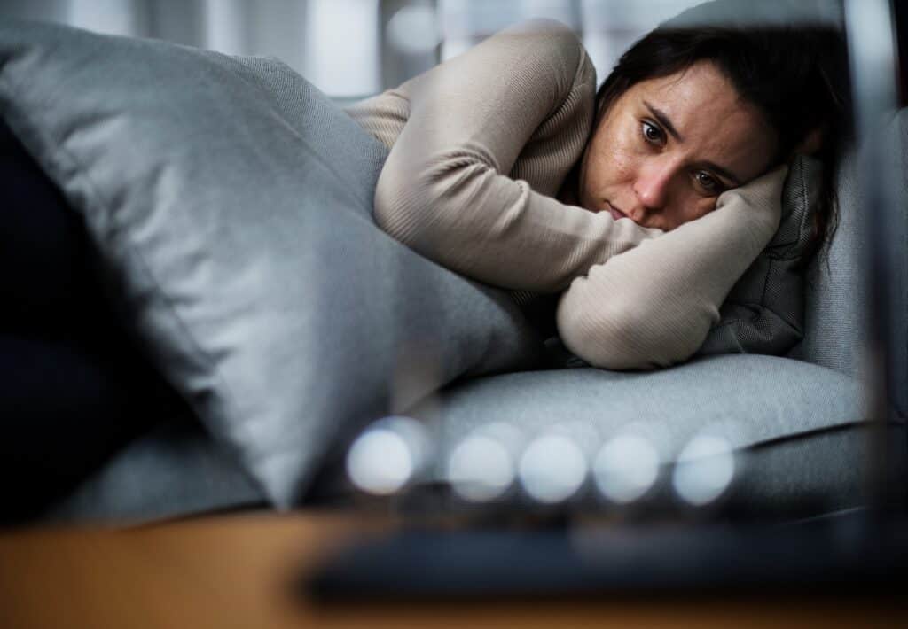 A woman learning the 5 signs of depression during recovery treatment.