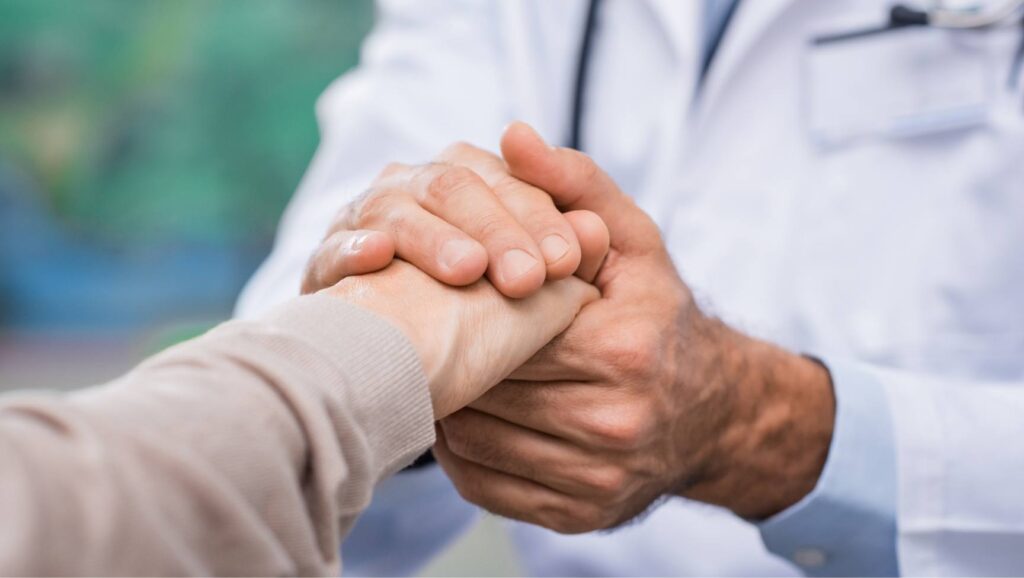 Doctor offering support while discussing “Is Wellbutrin addictive?” with a client.