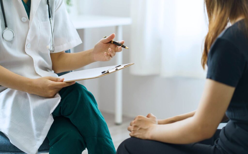 Doctor discussing the risks of the Pink Panther drug with a client.