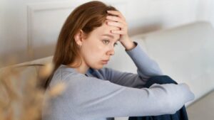 A woman struggling with depression and withdrawal symptoms.