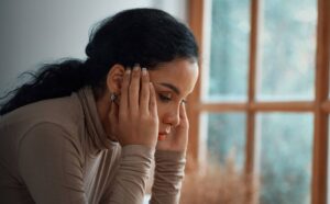 Woman experiencing the effects and signs of benzo addiction.