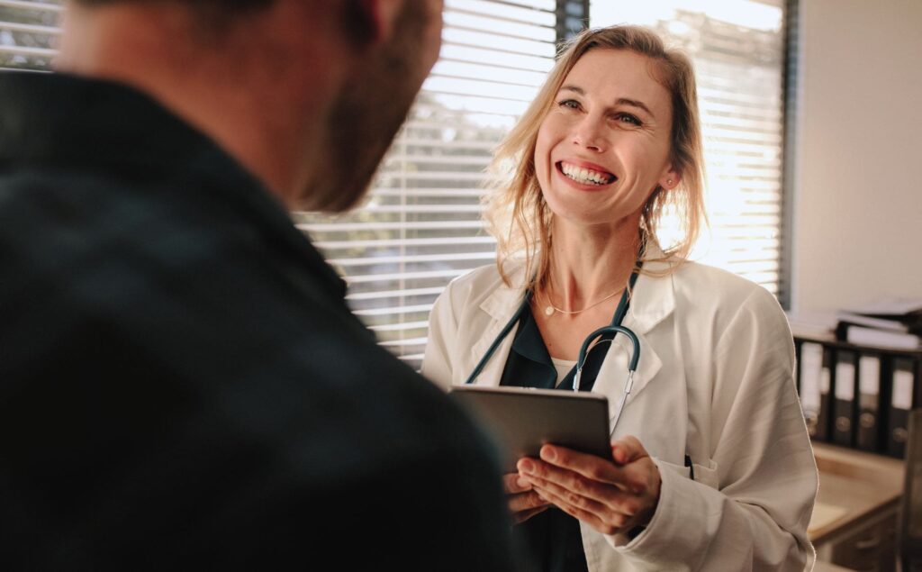 Professional guiding client through addiction treatment at a Florida rehab for professionals.