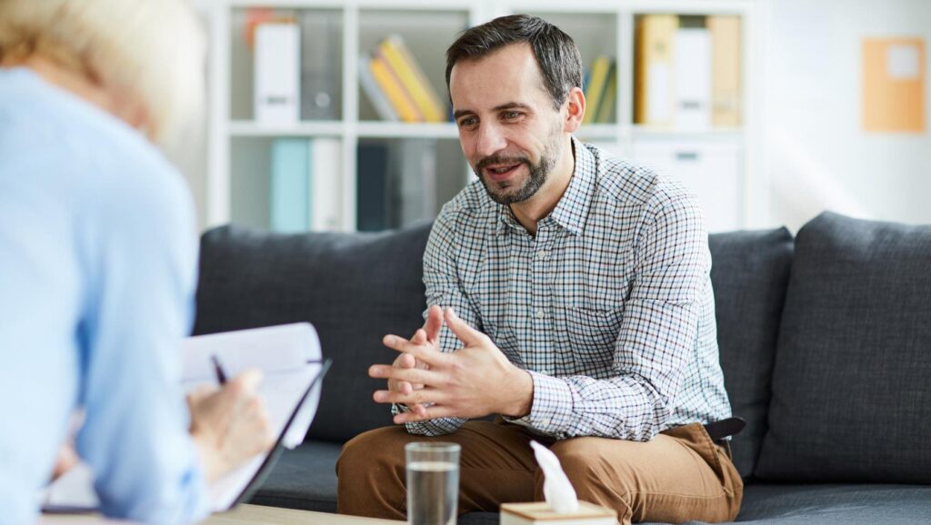 Man discussing an aftercare plan during Florida rehab for professionals.