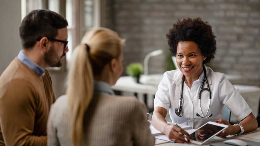 A couple learns about the process of detoxing from drugs during a recovery consultation.