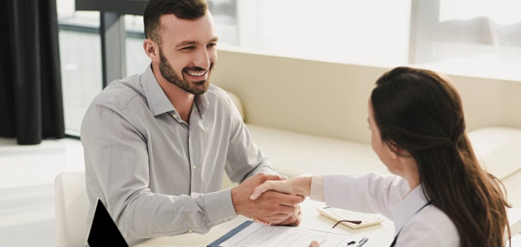 Man meeting healthcare professional during medical detox program.