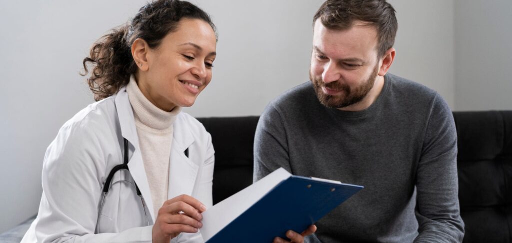 Professional explaining a transition plan to a client in a medical detox program.