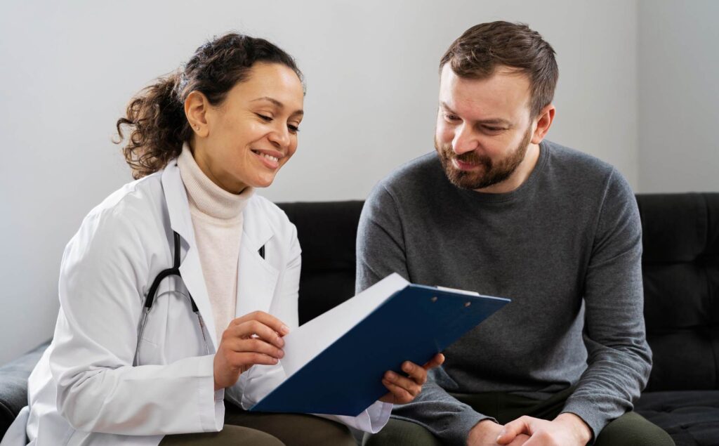 Professional helping client with insurance at detox near Coral Gables.