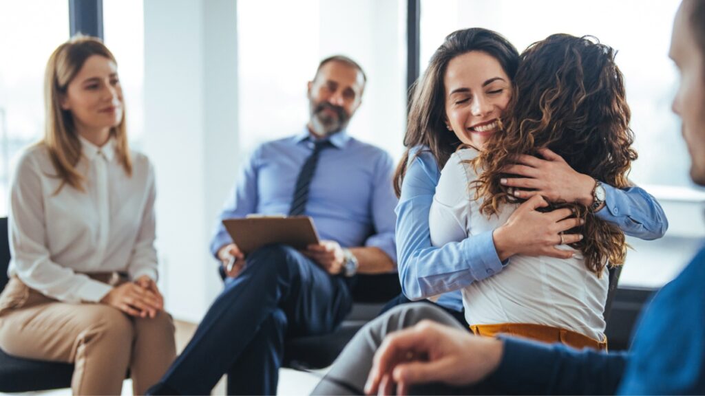 A woman enjoys aftercare treatment after learning how to rewire your brain from addiction through recovery care.