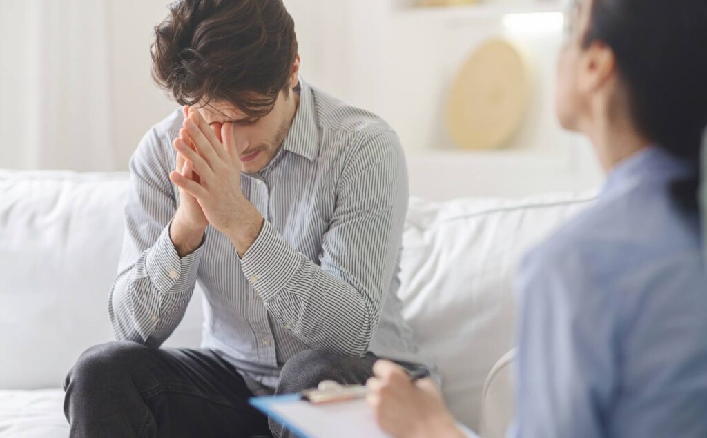 Man talking with therapist during borderline personality disorder treatment in Pompano Beach, FL.