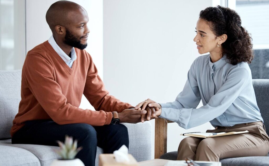 Man receiving support from a therapist during PTSD treatment in Pompano Beach, FL.