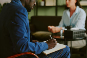 Man taking notes during Ativan detox in Pompano Beach FL treatment planning session